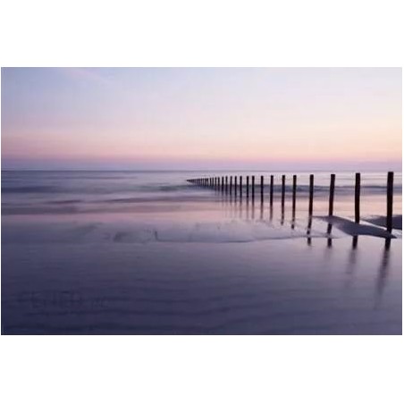 Beach breakwater - Strand i solnedgång